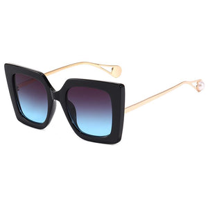 Coco UV400 Sunglasses Gold And Pearl Frame With Purple Blue Lenses.